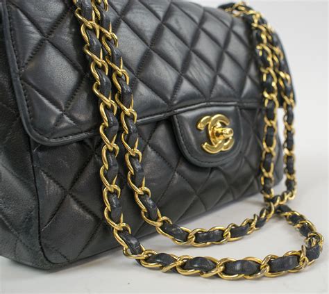 chanel bag gold and black|Black Chanel bag gold chain.